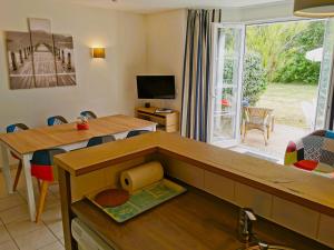 TV a/nebo společenská místnost v ubytování Le Flamingo Piscines chauffees