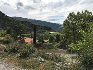 a view of a valley with mountains and trees at Gîte Le Cabanon in La Robine