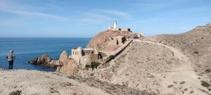 a man standing on the side of a mountain at PENSION NAVAS in El Cabo de Gata