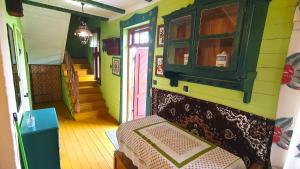 a room with a bedroom with a bed in it at Czworaki Dworskie - Kiermusy in Kiermusy