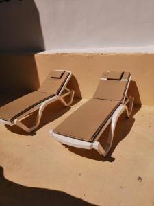 a pair of beds sitting in a room at Maison de ville sousse in Sousse