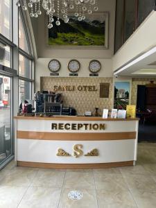 a store with a counter with clocks on the wall at Sanli Hotel Hammam & SPA in Trabzon