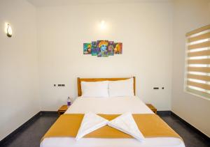 Postel nebo postele na pokoji v ubytování Ocean View Beach Villa Varkala by VOYE HOMES