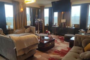 a living room with two couches and a table at Appartement La Suite Royale Centre Luxembourg 2 chambres in Luxembourg