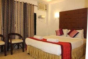 Katil atau katil-katil dalam bilik di Hotel Rhishabh