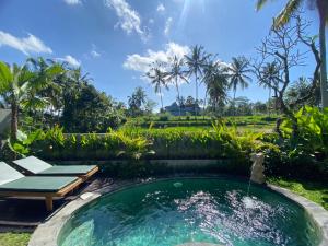 a pool in the yard of a villa at Arvanya Villa Ubud in Tegalalang