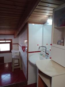 a bathroom with a sink and a toilet at Casa di Rosy in San Sperate