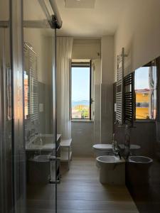 a bathroom with two sinks and a shower at Casa Zelia in Ercolano +13 photos