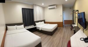 Sjónvarps- og/eða afþreyingartæki á T SQUARE HOTEL (IPOH)