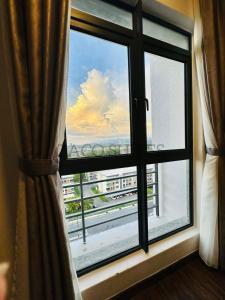 a window with a view of a city view at K Avenue 2-3PAX Studio Homestay by Zaco Suites in Kota Kinabalu