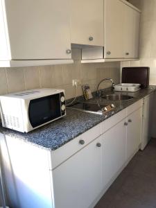 A kitchen or kitchenette at Apartamentos de la Hoz