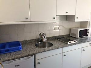 A kitchen or kitchenette at Apartamentos de la Hoz