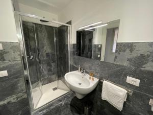 a bathroom with a sink and a shower and a toilet at CaVecchie Desenzano in Desenzano del Garda +36 photos