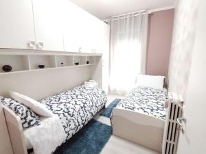 Appartamento Mari Mari tesisinde bir odada yatak veya yataklar