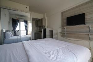 Легло или легла в стая в Capital O 93959 Apartement Gateway Cicadas By Mg Property