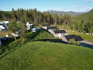 an aerial view of a home with a rv on a hill at Campinghytter ved Jotunheimen in Randsverk