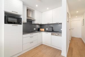 Køkken eller tekøkken på Renovated central seaview appartment "Atlanta"