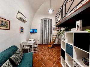 a living room with a table and a dining room at Light House Bisceglie in Bisceglie