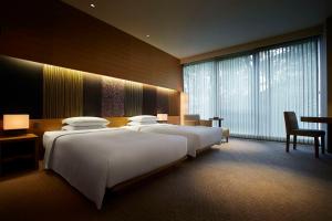 Voodi või voodid majutusasutuse Hyatt Regency Kyoto toas