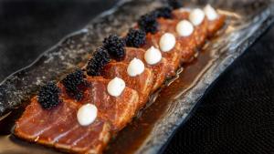 two waffles with blackberries and marshmallows on a plate at Conrad Algarve in Quinta do Lago