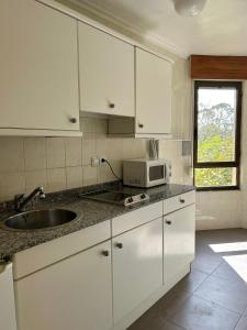A kitchen or kitchenette at Apartamentos de la Hoz