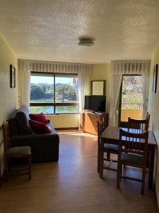 A television and/or entertainment centre at Apartamentos de la Hoz