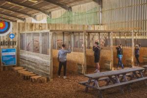 een groep mensen die in een gebouw staan bij Dome Meadows 4 At Tapnell Farm in Yarmouth