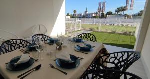 a table with chairs and a table with a view of a field at Apartamento Domara Vera in Vera