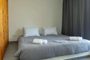 Postel nebo postele na pokoji v ubytování DeKo Penthouse Suite