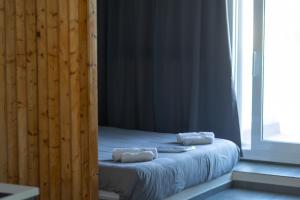Postel nebo postele na pokoji v ubytování DeKo Penthouse Suite