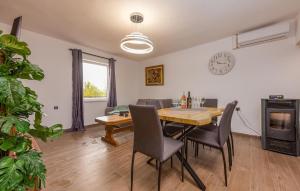 a dining room with a table and chairs at Nice Home In Gracac With Wifi in Gračac
