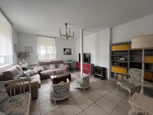 a living room with a couch and a table at Villa Merenciana in Agoncillo