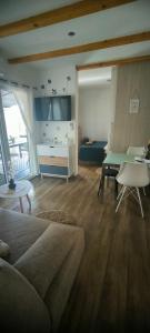 a living room with a couch and a table at Mobile home Ivan Vodice in Vodice
