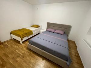 a bedroom with two beds in a room at Lina Apartmani in Plav