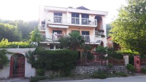 a large building with a fence and a gate at Villa Maja in Omišalj