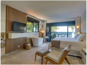 Cama ou camas em um quarto em Chez Louise et Louis Pé na Areia