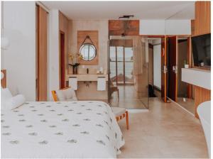 Cama ou camas em um quarto em Chez Louise et Louis Pé na Areia