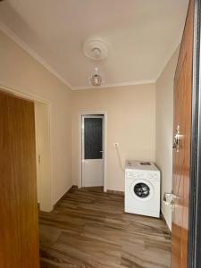 an empty room with a washing machine in it at Apartment Koka in Berat
