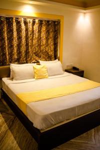 Ένα ή περισσότερα κρεβάτια σε δωμάτιο στο Bhagyoday