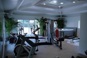 a gym with two exercise bikes and a treadmill at Mobil Home in Valras-Plage