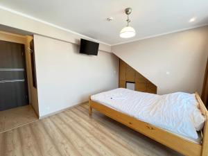 Ένα ή περισσότερα κρεβάτια σε δωμάτιο στο Willa Zieloneczka +25 φωτογραφίες