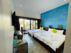 Postel nebo postele na pokoji v ubytování Chhouy Vathna Angkor Boutique + 33 fotografií