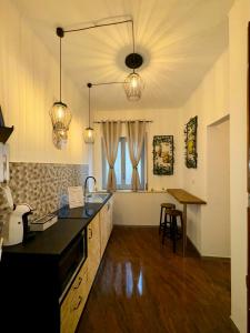 a kitchen with a sink and a counter top at Del Regno Holiday House in Pompei