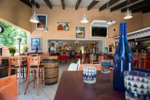 a restaurant with a table with a blue bottle on it at Mobil Home in Valras-Plage