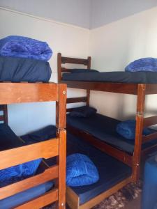 a group of bunk beds in a room at Pousada Espaço Cosmos in Águas da Prata