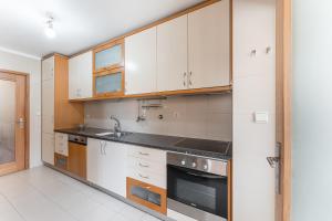 Η κουζίνα ή μικρή κουζίνα στο GuestReady - My Home in Leça