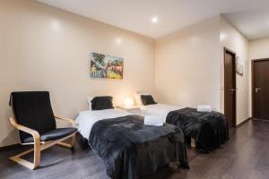 Ένα ή περισσότερα κρεβάτια σε δωμάτιο στο GuestReady - Enigma Apartments