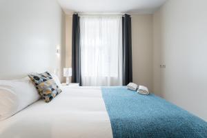 Ένα ή περισσότερα κρεβάτια σε δωμάτιο στο GuestReady - Enigma Apartments