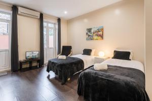 Ένα ή περισσότερα κρεβάτια σε δωμάτιο στο GuestReady - Enigma Apartments