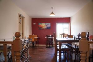 a dining room with a table and chairs at Seaview Lodge in Inverin